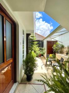 an internal courtyard of a house with potted plants at Allincay Cusco Apart Hotel in Cusco