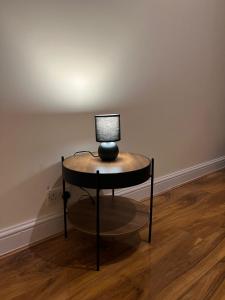 a lamp sitting on a table in a room at 3 Bedroom Apartment in London