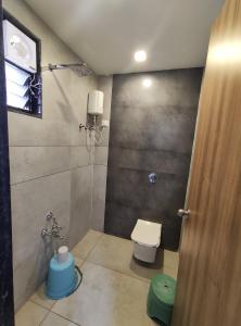 a bathroom with a toilet and a shower at HOTEL SHREE RAM in Rājpīpla