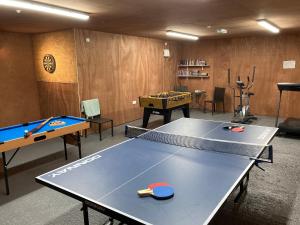 a ping pong room with a ping pong table at Llaethdy - The Dairy in Newchapel