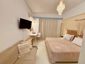 Кровать или кровати в номере Afroditi Junior Suites