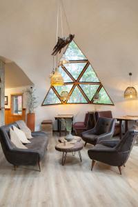 a living room with a large glass window at Ascenso Kimun in Pucón