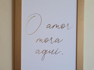 a sign with the words amore morena again at Porto Viejo Ô de Casa Natal RN in Natal