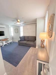 a living room with a couch and a table at Lovely Renovated 1Bdrm 1Bath Getaway in Ocean City