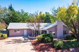 a house with a driveway and trees at Spacious W Sedona 4 bedroom Contemporary House! in Sedona