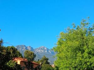 a view of the mountains from the street at APPARTEMENT AU CALME in Menton