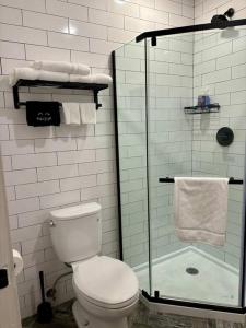 a bathroom with a toilet and a glass shower at Veau3 1BD 1BA minutes to NYC in Newark +7 photos