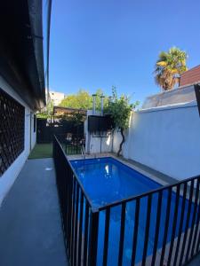 a swimming pool on the side of a building at Casa Guemes in Santiago