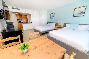 Postel nebo postele na pokoji v ubytování SeaStays Apartments