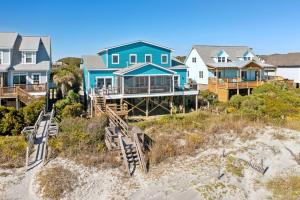 a group of houses on the beach at BeachZilla - 907 East Arctic in Folly Beach