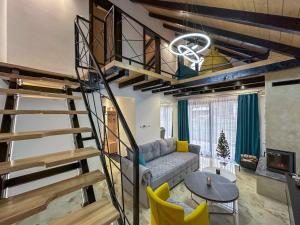 a living room with a spiral staircase and a couch at The View Luxury Chalet in Jahorina
