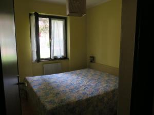 Postel nebo postele na pokoji v ubytování Carè Alto