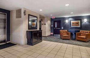 a lobby with a waiting room with chairs and a mirror at Extended Stay America Suites - Houston - Westchase - Richmond in Houston