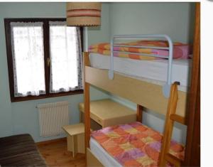 Postel nebo postele na pokoji v ubytování Carè Alto