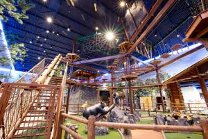 a zoo with an elephant and stairs in a building at Great Wolf Lodge Georgia in LaGrange