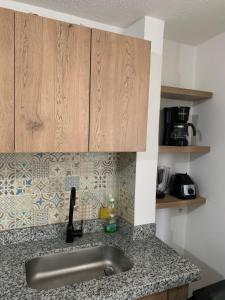 Kuchyň nebo kuchyňský kout v ubytování Bellísimos apartamentos céntricos en La Mesa