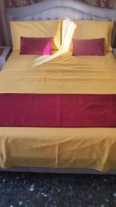 Ein Bett oder Betten in einem Zimmer der Unterkunft La Casa di Sonia