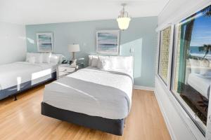 Ένα ή περισσότερα κρεβάτια σε δωμάτιο στο Essence of the Ocean 2nd Floor Oceanview Room