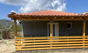 a small house with a red roof at Cottage Karanikola in Sikia