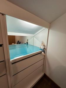 a glass room with a swimming pool inside of it at Casa dos Amigos Panoramic View in Funchal