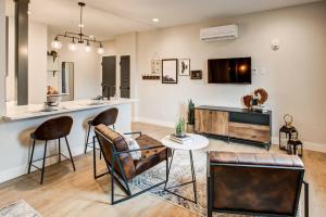 a living room with a bar and a table at RALEIGH Studio with Full Kitchen in Denver