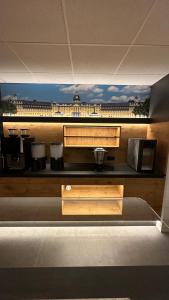 a view of a kitchen with aasteryasteryasteryasteryasteryasteryasteryasteryastery at Hotel Am Markt in Karlsruhe