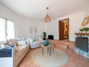 a living room with a couch and a table at Great Holiday home in Benissa with pool in Benissa