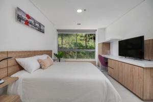 Postelja oz. postelje v sobi nastanitve PORTANOVA Suites by ADVENTU