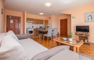 a living room with a couch and a table at Apartman Mira in Makarska