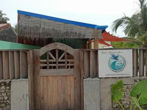 a gate at a resort with a sign on it at MAMELLO Beach Club Maldives in Feridhoo