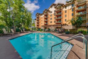 a swimming pool in the courtyard of a apartment building at Baskins Creek Condos in Gatlinburg