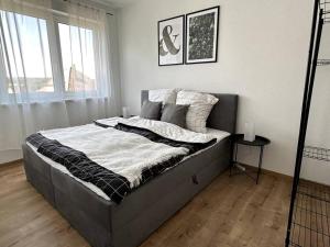 Кровать или кровати в номере Modernes Wohnen für 6 im Neubau!
