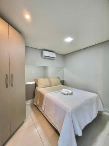 En eller flere senge i et værelse på Ap no Bairro do Bessa-2 quartos