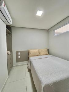 En eller flere senge i et værelse på Ap no Bairro do Bessa-2 quartos