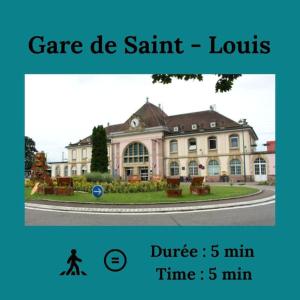 a large building with a person walking in front of it at Bali suites - Basel / Dreilander in Saint-Louis