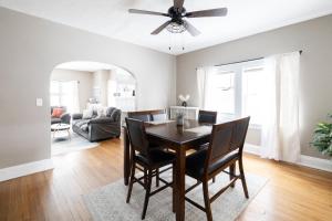 a dining room and living room with a table and chairs at Stylish 3-bd Haven in Trendy Cleveland Heights! in Cleveland Heights