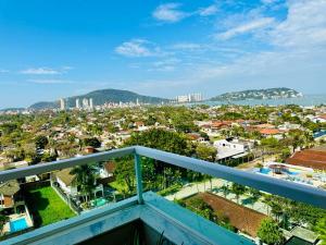 a view of a city from a balcony at Vista Panorâmica Enseada in Guarujá
