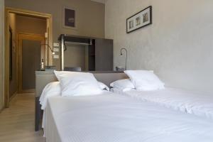 Postel nebo postele na pokoji v ubytování M14 Hotel & Spa