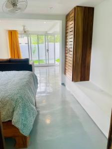 a bedroom with a floor that is covered in water at Cozy Studio in Private Villa in Las Terrenas