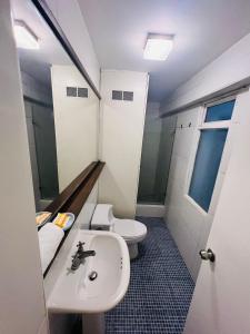 a bathroom with a sink and a toilet at Duplex en primer piso - A media Cuadra Embajada USA in Lima