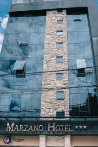 a reflection of a marfa hotel on the side of a building at Marzano in Cajamarca