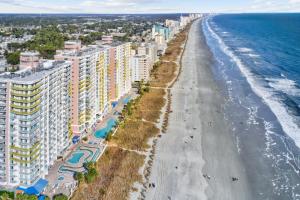 an aerial view of the beach and buildings at Bay Watch Resort in Myrtle Beach