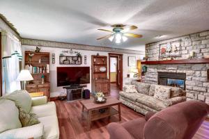 a living room with a couch and a fireplace at Charming Newark Home Less Than 10 Mi to Buckeye Lake in Newark