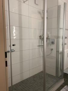 a shower with a glass door in a bathroom at Grünes Stüble Allgäuer Alpen in Sonthofen