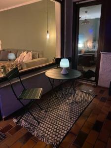 a living room with a table and a couch at Grünes Stüble Allgäuer Alpen in Sonthofen