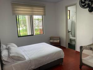 Postel nebo postele na pokoji v ubytování Casa finca La alegría - casa el Recreo