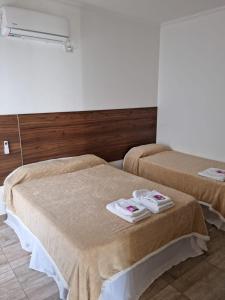 Ένα ή περισσότερα κρεβάτια σε δωμάτιο στο DEPARTAMENTOS RIVADAVIA