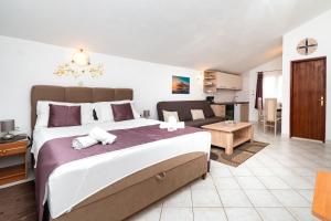 Postel nebo postele na pokoji v ubytování Apartments Miljenka