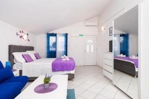 Postel nebo postele na pokoji v ubytování Apartments Miljenka