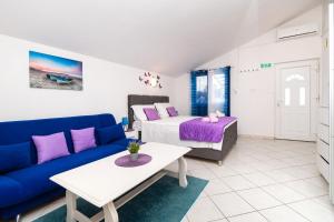 Postel nebo postele na pokoji v ubytování Apartments Miljenka